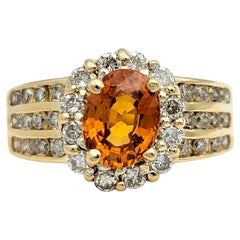 Oval Cut Spessartite Garnet and Diamond Halo Wide Band Ring 14 Karat Yellow Gold