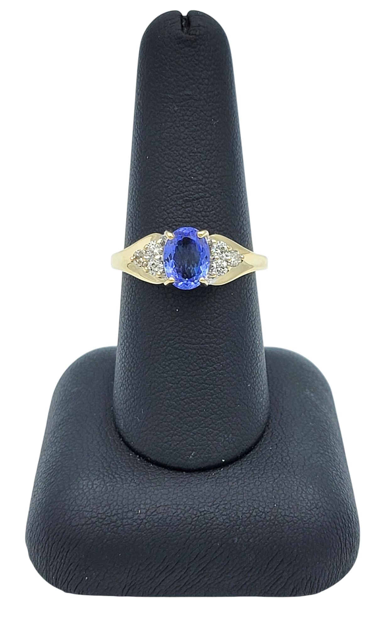 Oval Cut Tanzanite and Diamond Cluster Ring in Polished 14 Karat Yellow Gold For Sale 6