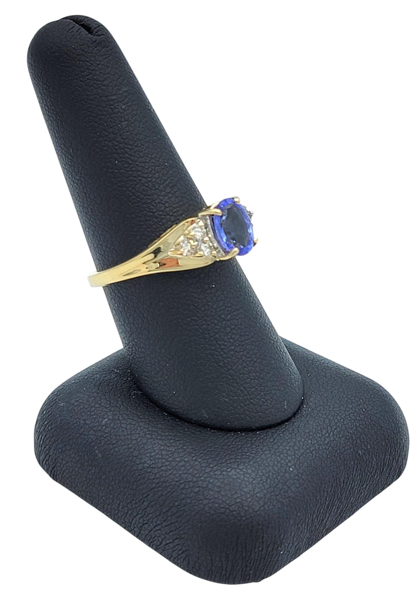 Oval Cut Tanzanite and Diamond Cluster Ring in Polished 14 Karat Yellow Gold For Sale 7