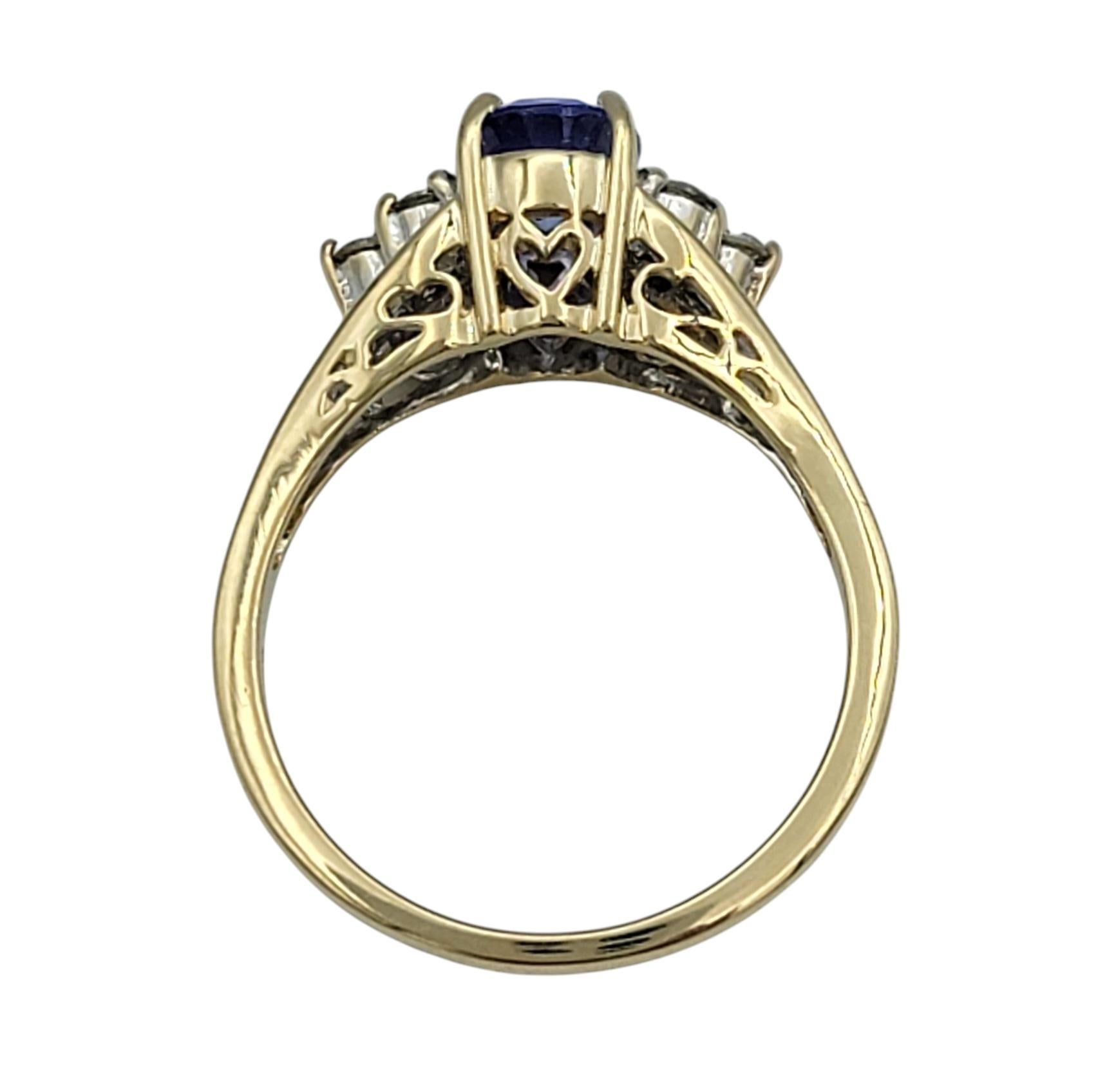 Oval Cut Tanzanite and Diamond Cluster Ring in Polished 14 Karat Yellow Gold For Sale 1