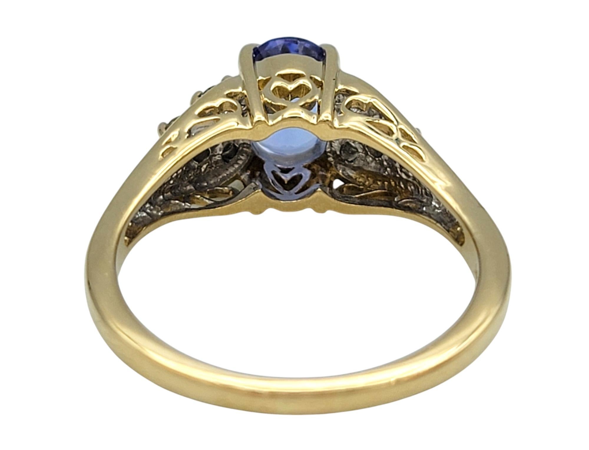 Oval Cut Tanzanite and Diamond Cluster Ring in Polished 14 Karat Yellow Gold For Sale 2