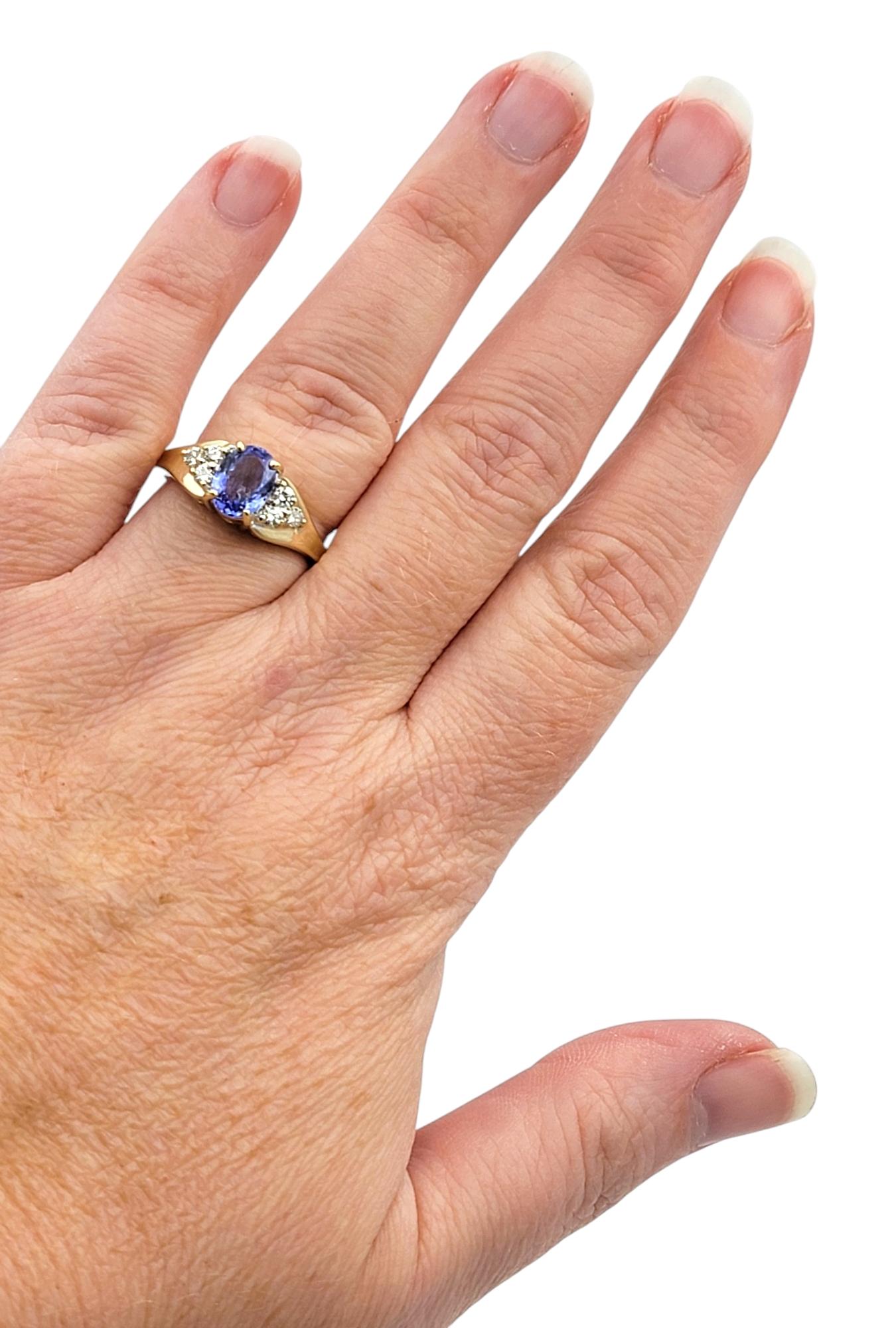 Oval Cut Tanzanite and Diamond Cluster Ring in Polished 14 Karat Yellow Gold For Sale 4
