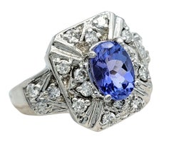 Oval Cut Tanzanite and Round Diamond Ornate Cocktail Ring in 14 Karat White Gold