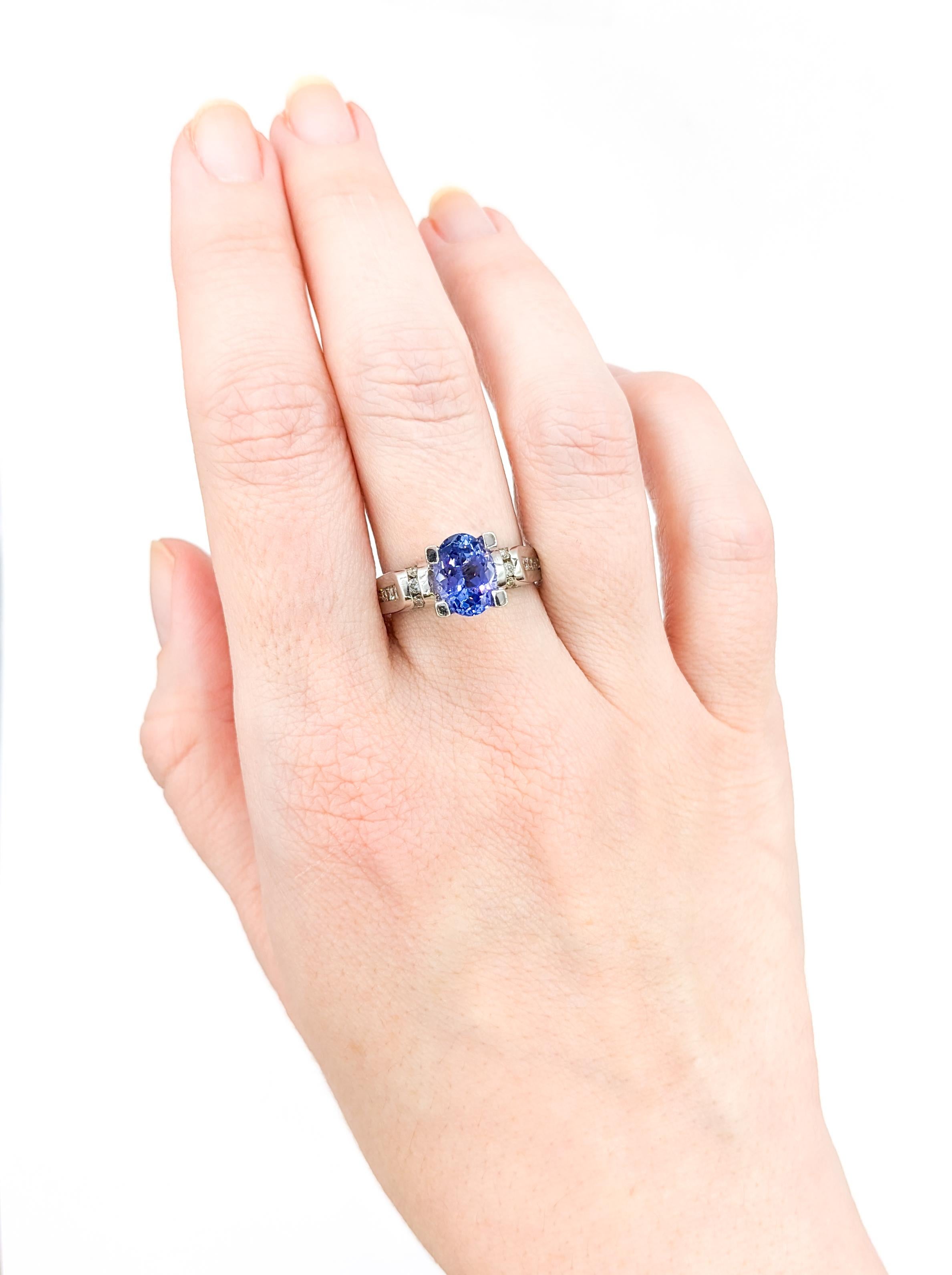 Oval Cut Tanzanite & Diamond Ring in White Gold

Introducing this beautiful Tanzanite and Diamond Ring. This piece features a captivating 1.8ct Tanzanite as its centerpiece, elegantly set in 14K White Gold. Complementing this striking purple-blue