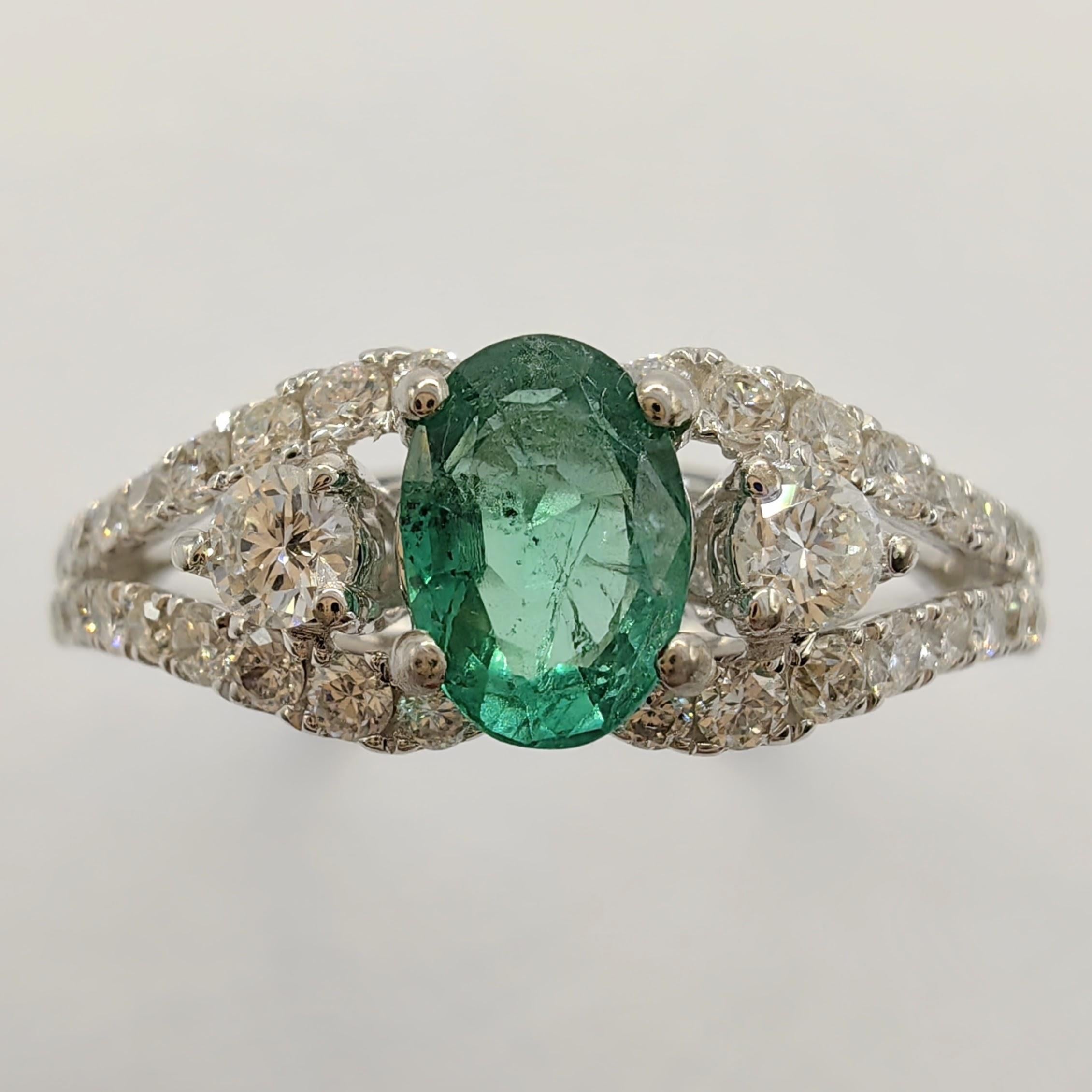 Contemporary Oval-Cut Vivid Green Emerald Diamond Cluster Ring in 18k White Gold For Sale