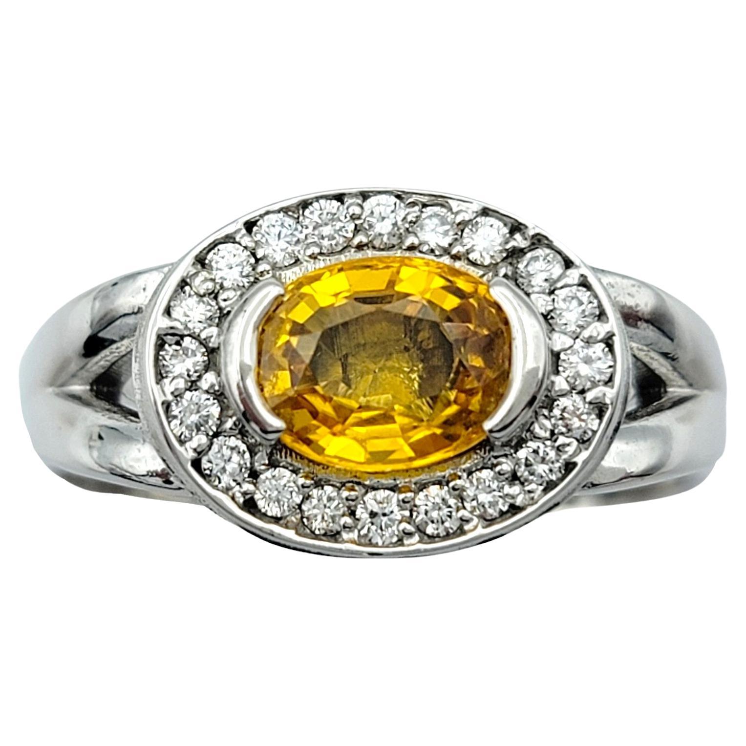 Oval Cut Yellow Sapphire and Diamond Halo Squared Band Ring in 14 Karat Gold In Good Condition For Sale In Scottsdale, AZ