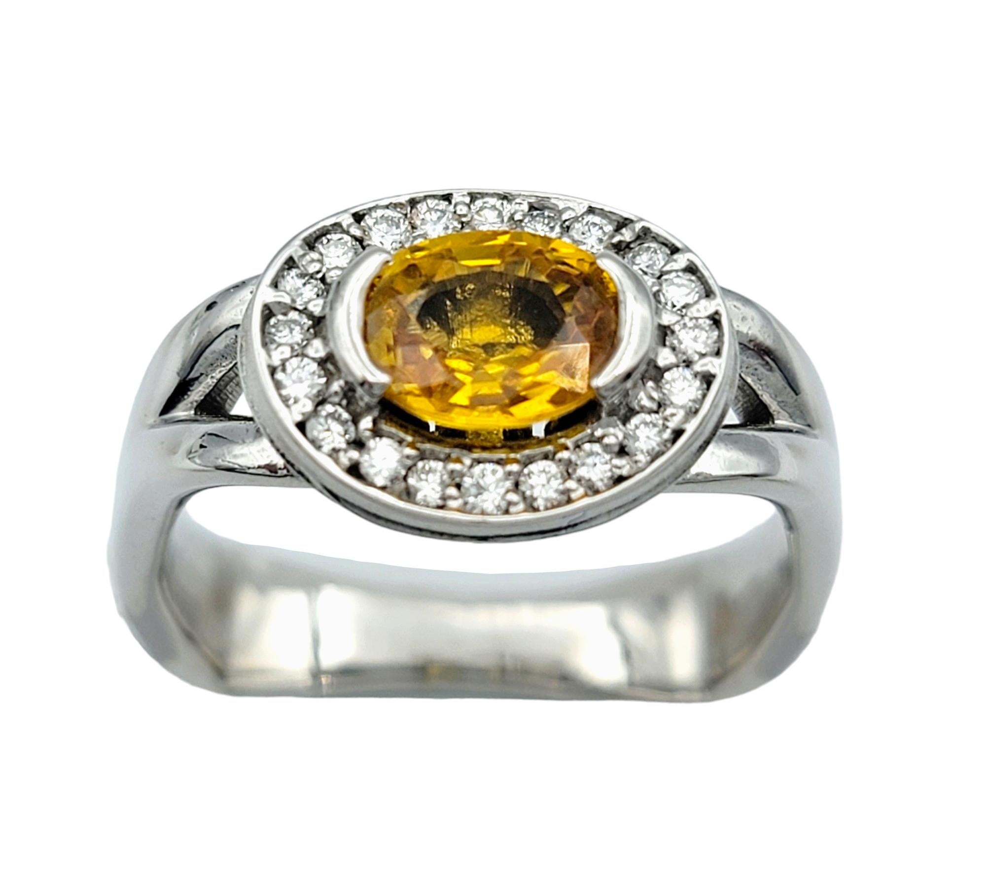 Contemporary Oval Cut Yellow Sapphire and Diamond Halo Squared Band Ring in 14 Karat Gold For Sale