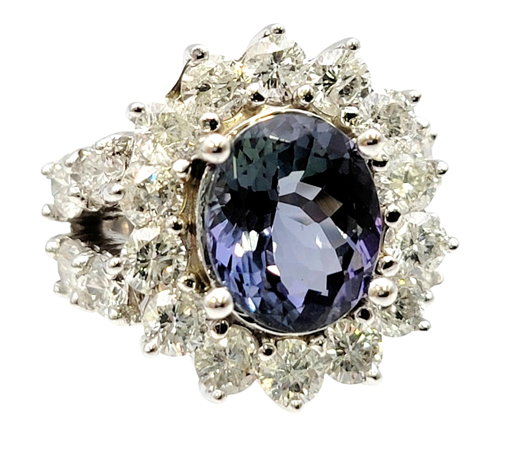 Ring size: 5.25

You will absolutely adore this strikingly sparkly zoisite and diamond halo ring. Bursting with sparkle, the unique greenish-blue oval cut zoisite stone really pops against the icy white diamonds and polished 14 karat white gold