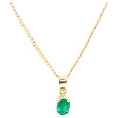 Oval Deep Green Natural Emerald Vintage Pendant and Fine Chain in 18 Carat Gold