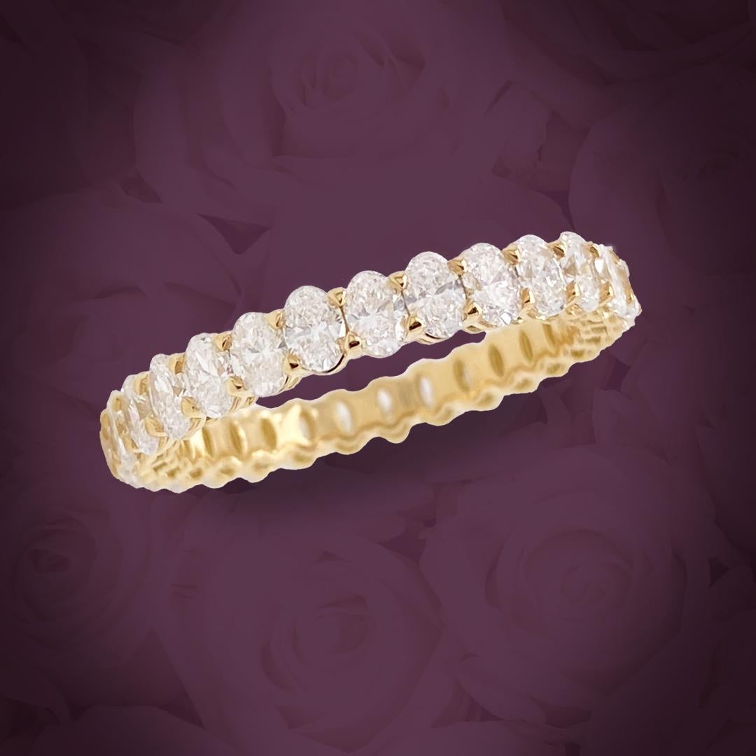 This beautiful petite Oval diamond eternity band features 6 Pointer diamonds.
The ring has 29 oval diamonds, and a total carat of 1.99.
The diamonds are F color, and VS-SI clarity.
The ring is set in 18K Yellow Gold and is a finger size 6.5.
