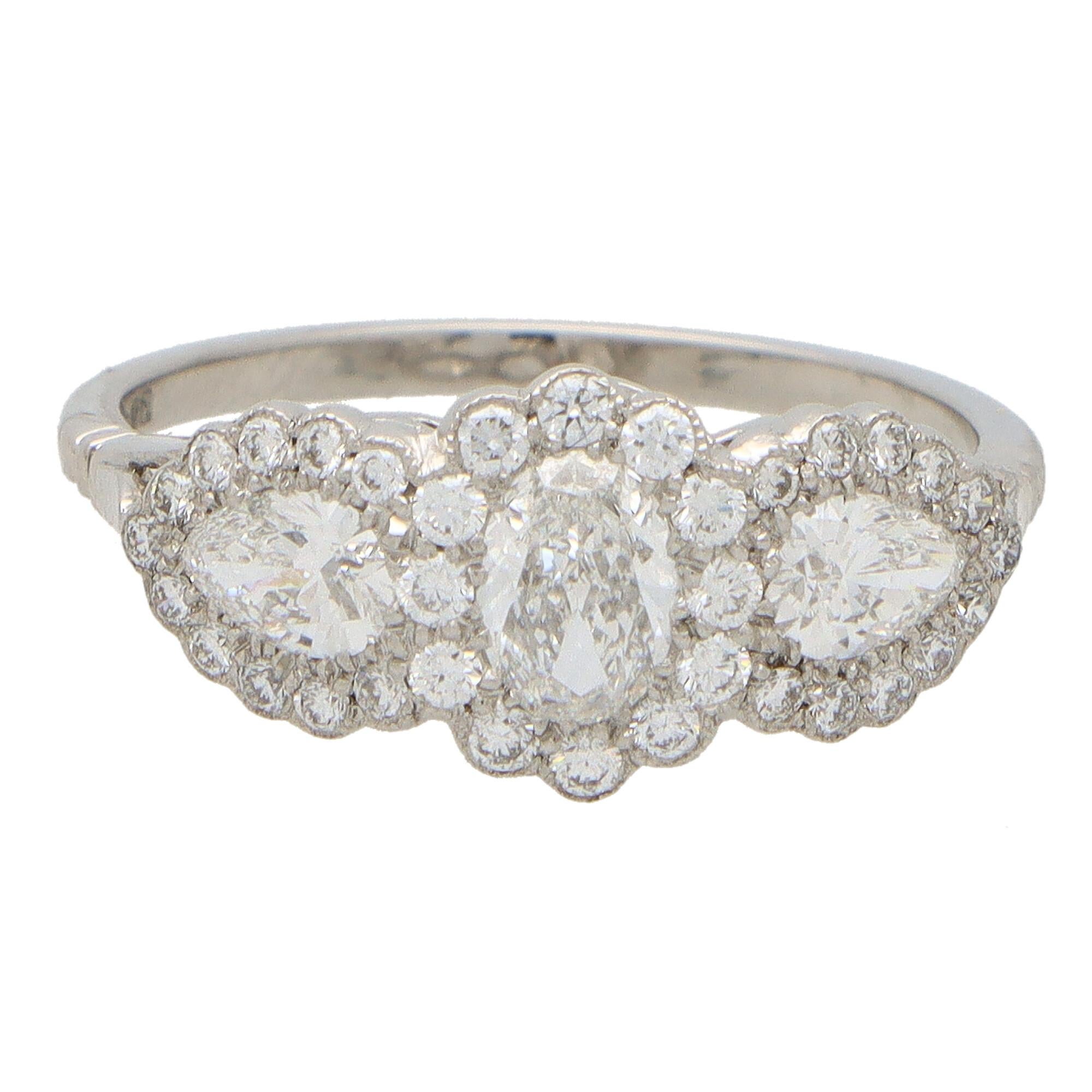 Modern Oval Diamond Floral Cluster Three Stone Ring Set in Platinum