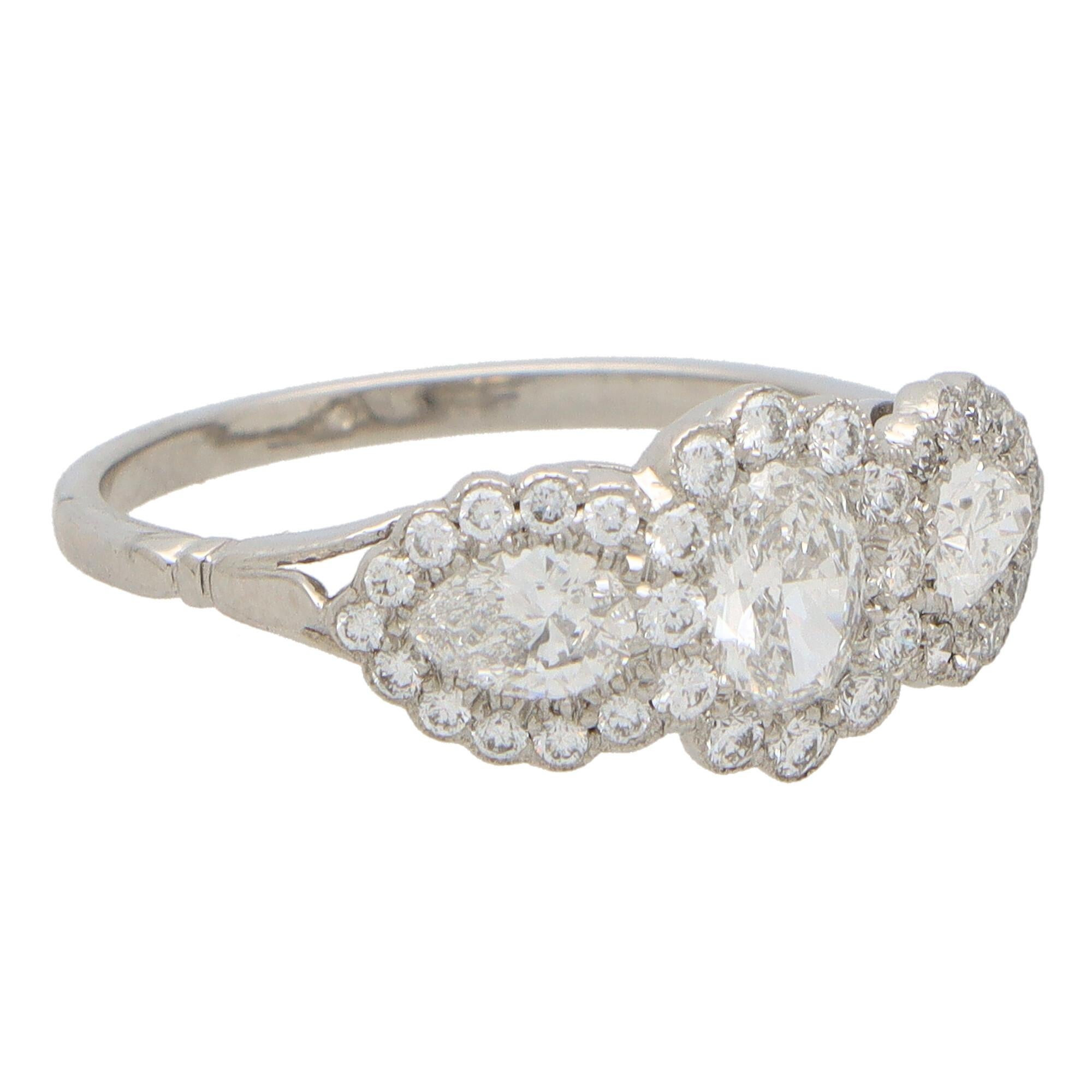 Oval Cut Oval Diamond Floral Cluster Three Stone Ring Set in Platinum