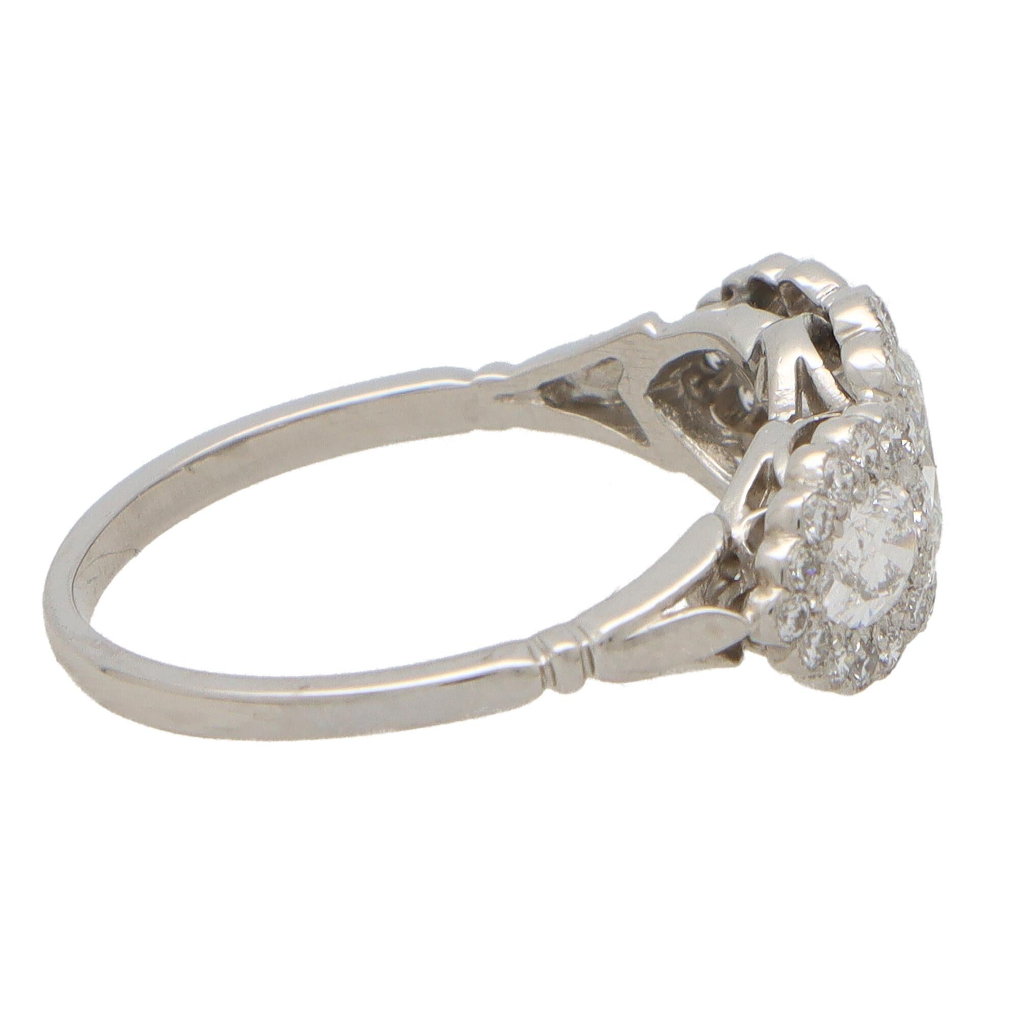 Oval Diamond Floral Cluster Three Stone Ring Set in Platinum In New Condition In London, GB