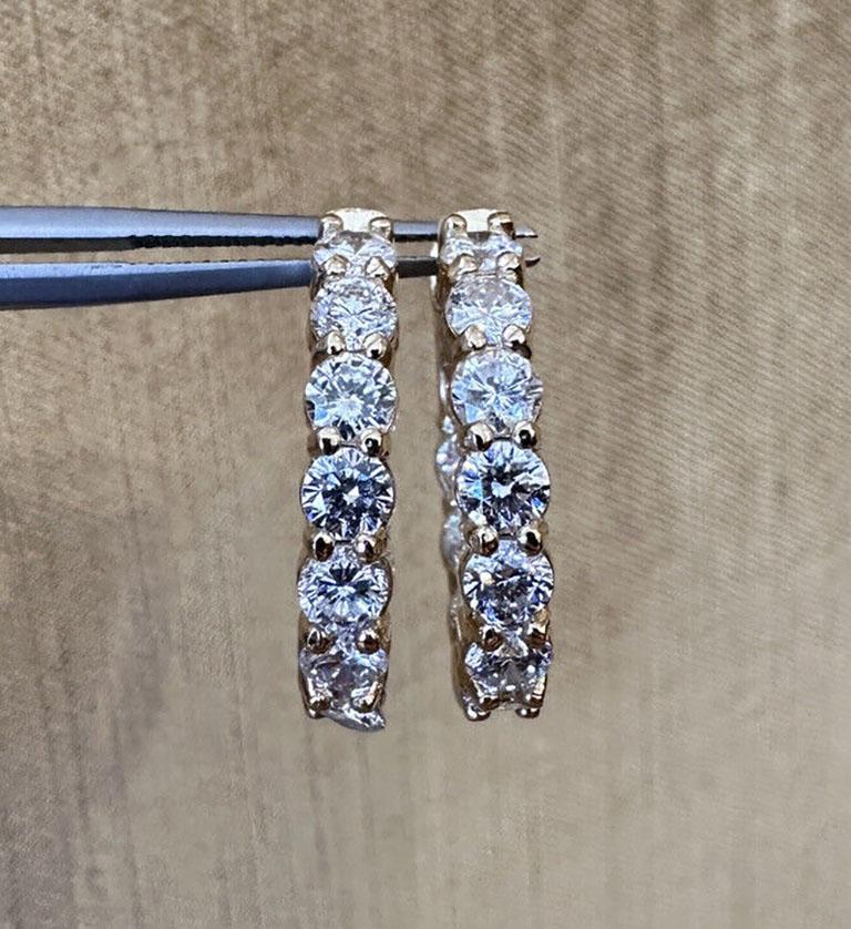 Oval .90 inch Diamond Hoop Earrings Inside Out 3.73 Carat Total Weight in 14k Yellow Gold

Diamond Hoops features a single row of clean, lively Round Brilliant Diamonds on inside and outside with 20 diamonds in total set in 14k Yellow Gold. Earrings