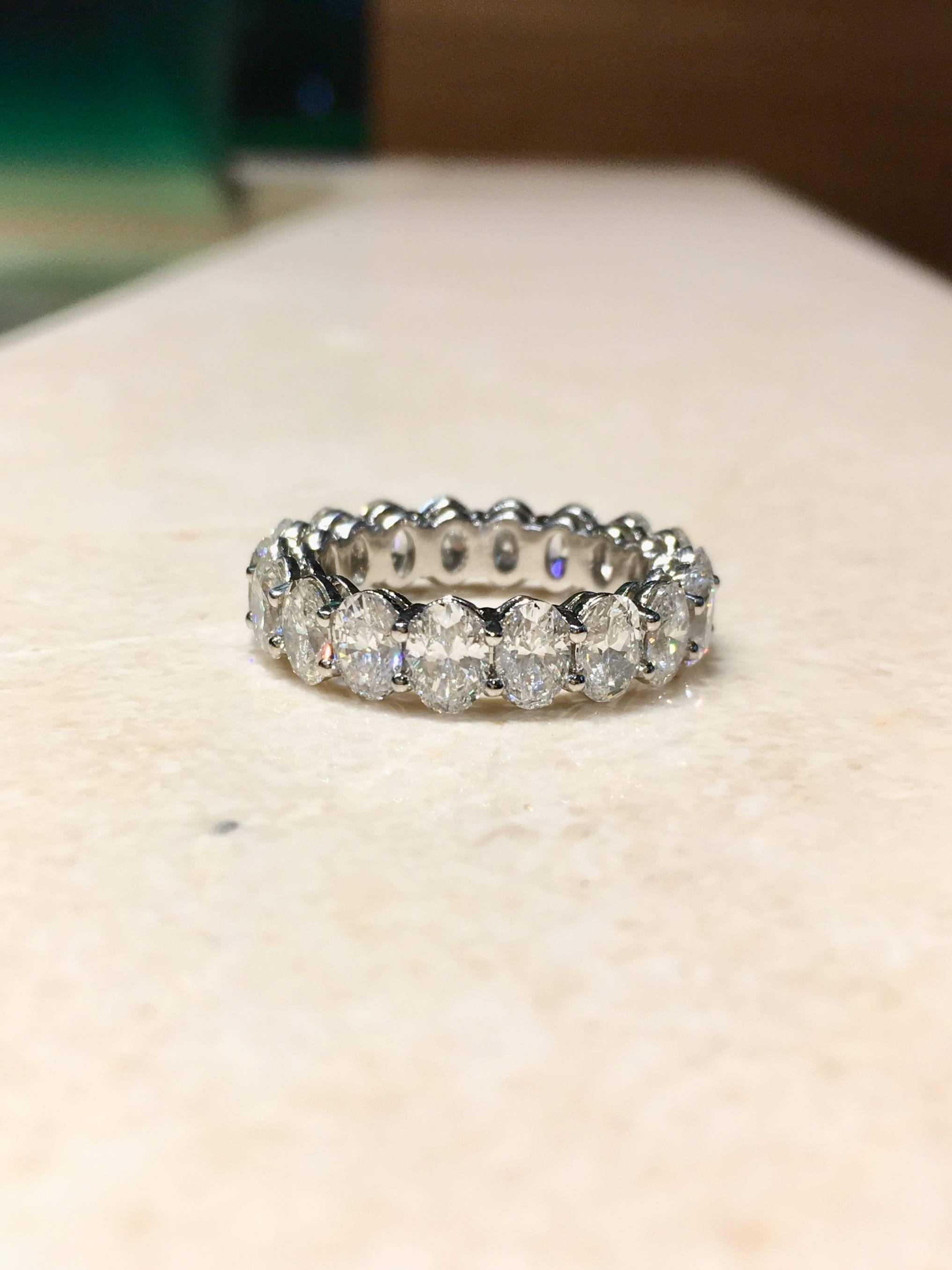 Oval diamond platinum eternity band 5.58 carat weight.  This stunning ring has shared prongs featuring 18 oval shaped diamonds VS2 clarity, G - I colour, good cut. Finger size 6.5