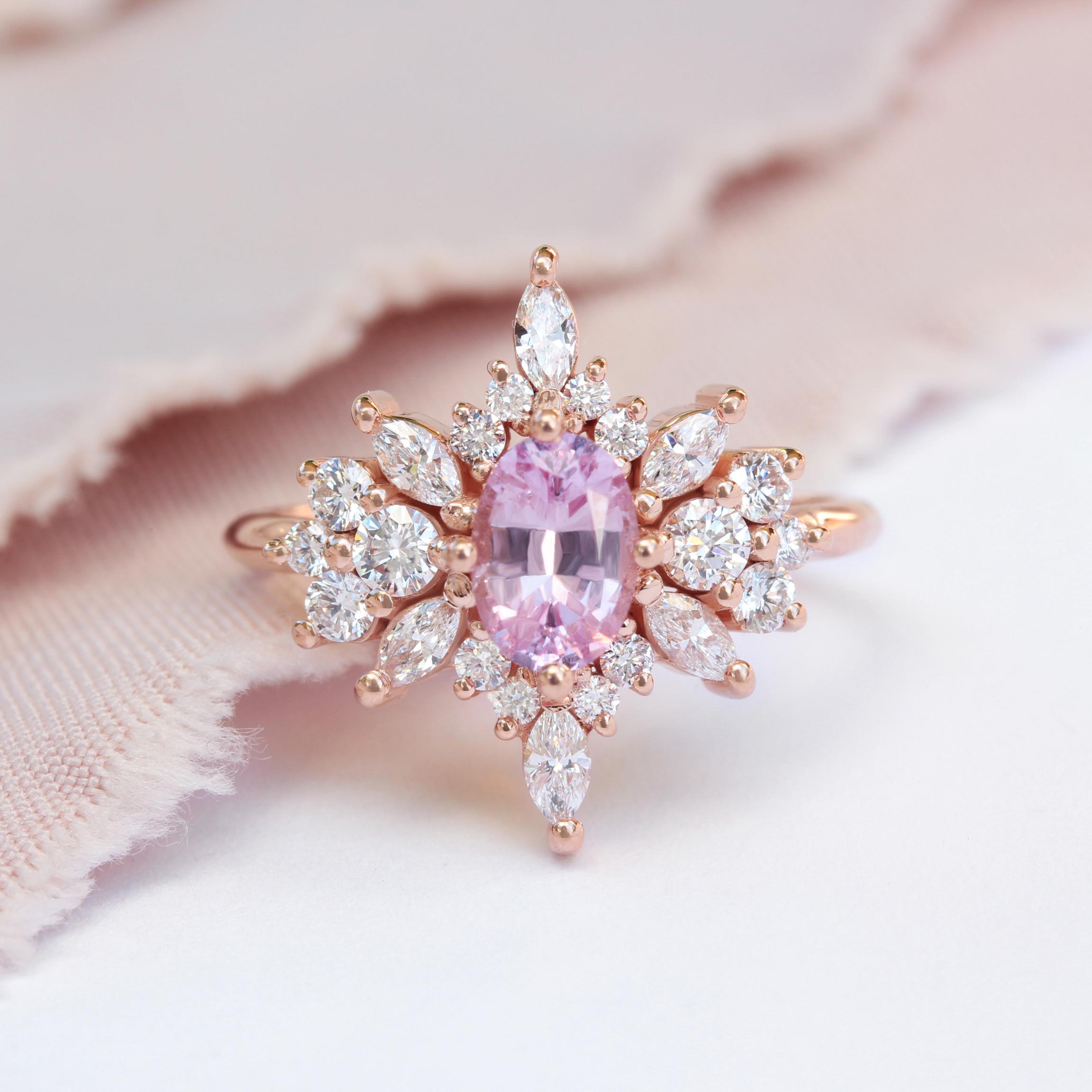 Unique and stunning Oval Pink Sapphire & Diamonds cluster engagement ring - Phoenix.
Sapphire is September's birthstone. It has been believed to bring inner peace, protect against harm, and enhance spiritual growth. 

Each ring is handmade and