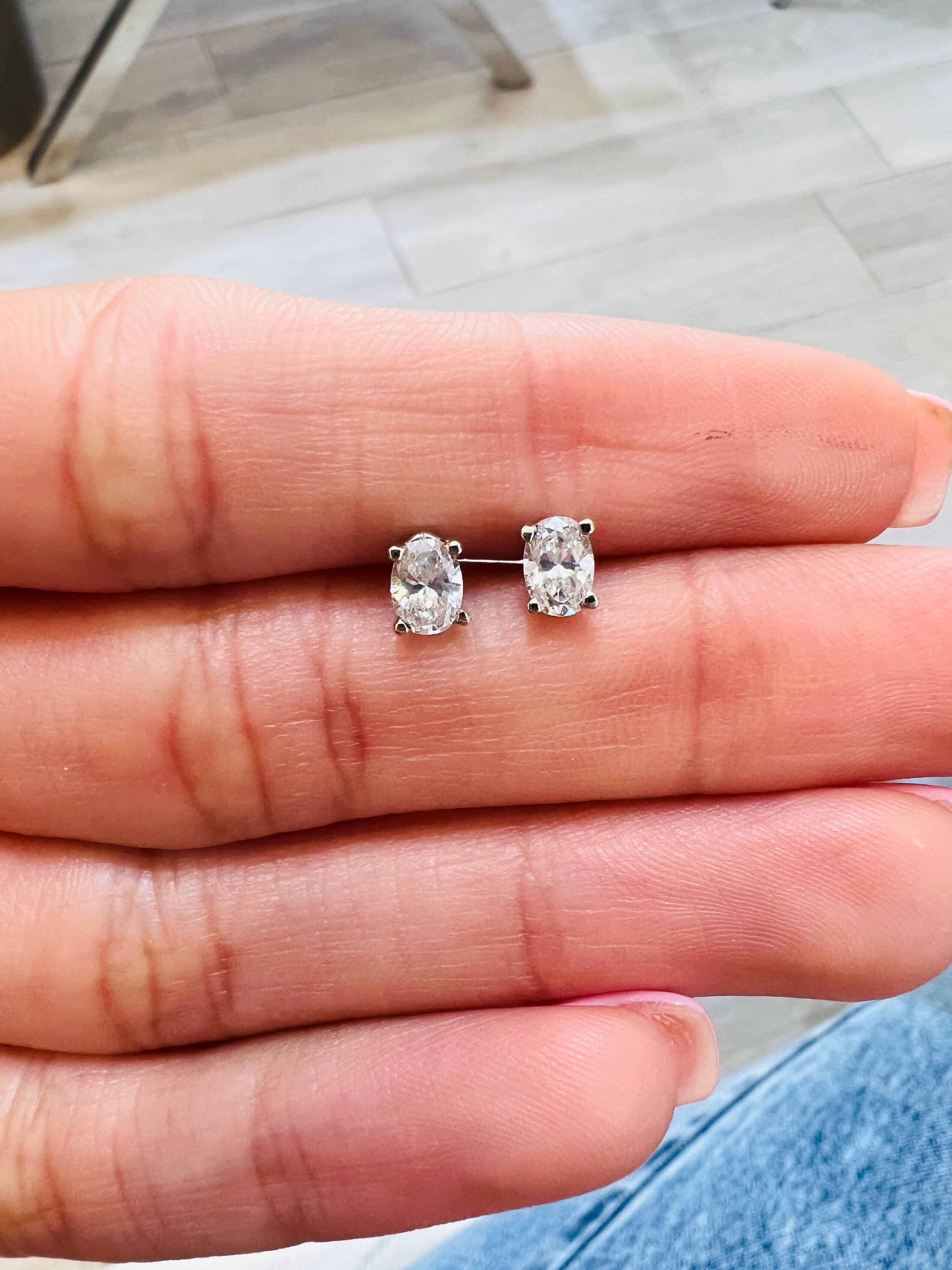 These lovely oval stud earrings are perfect for any ear! These are beautiful alone or worn as an accent next to larger earrings! The total weight of these diamonds is 0.50 carats (or slightly more) with near-colorless G-I color and VS-SI clarity.