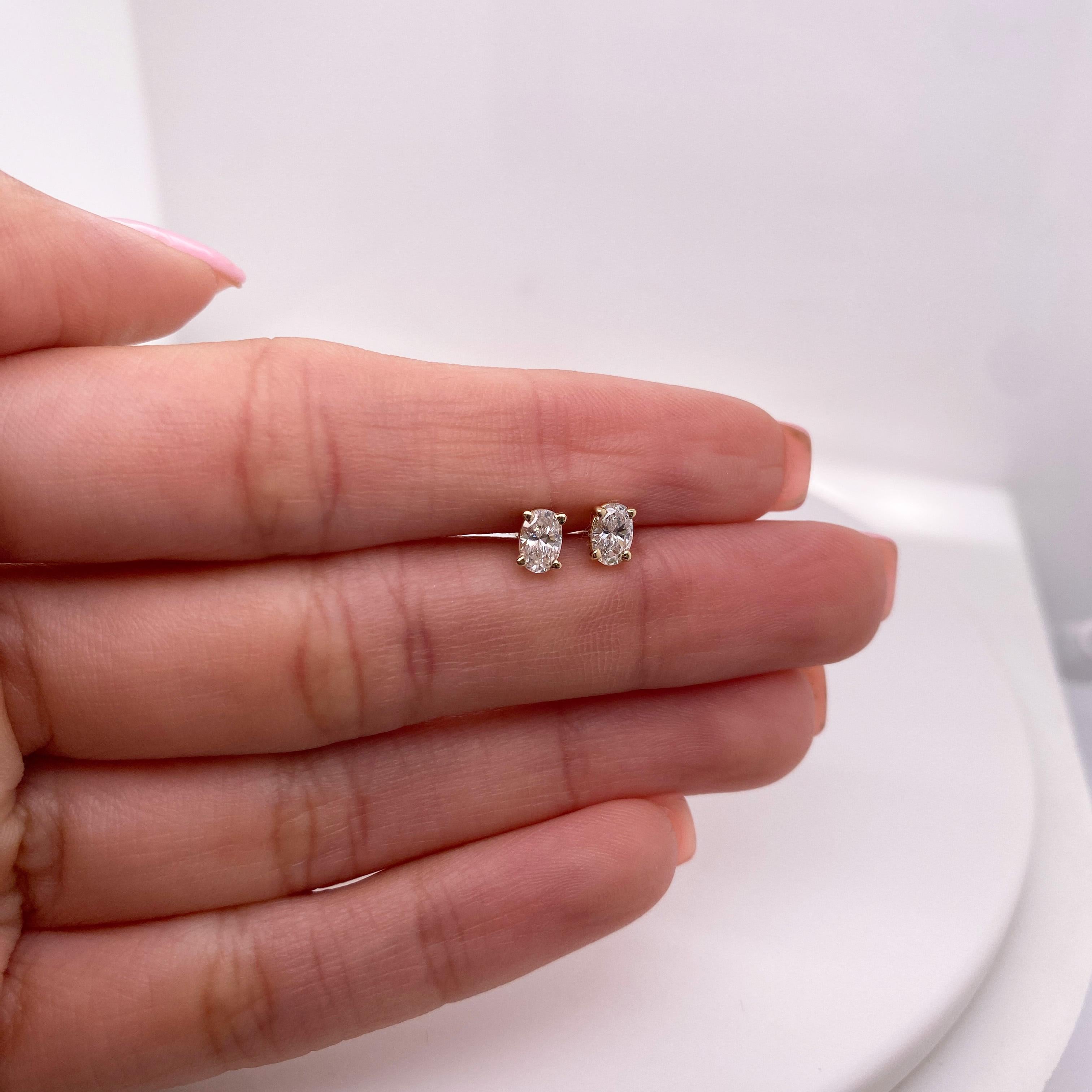 These lovely oval stud earrings are perfect for any ear, looking beautiful when worn alone or as an accent next to larger earrings! The total weight of these diamonds is 0.50 carats (or slightly more) with near-colorless G-I color and VS-SI clarity.