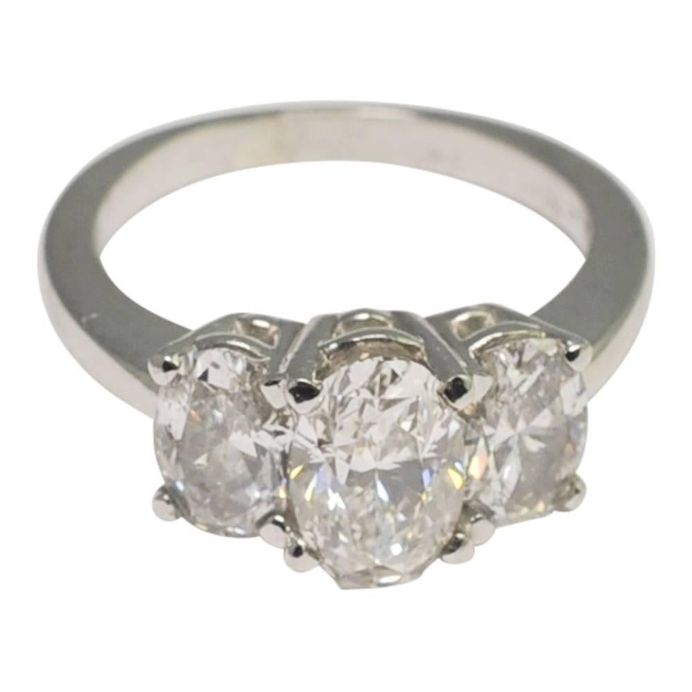 Oval Cut Oval Diamonds and Platinum Trilogy Ring For Sale