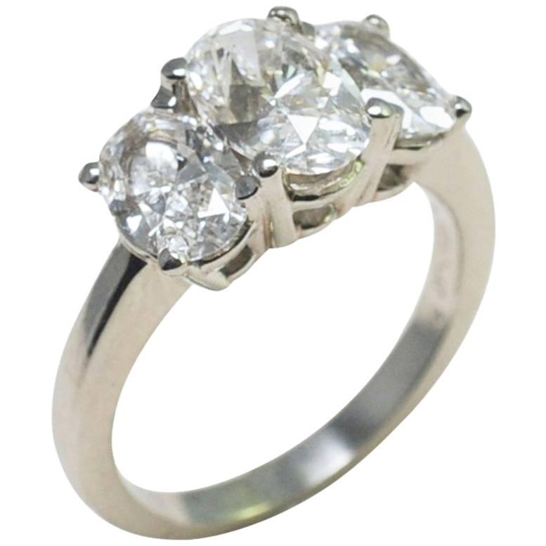 Oval Diamonds and Platinum Trilogy Ring For Sale