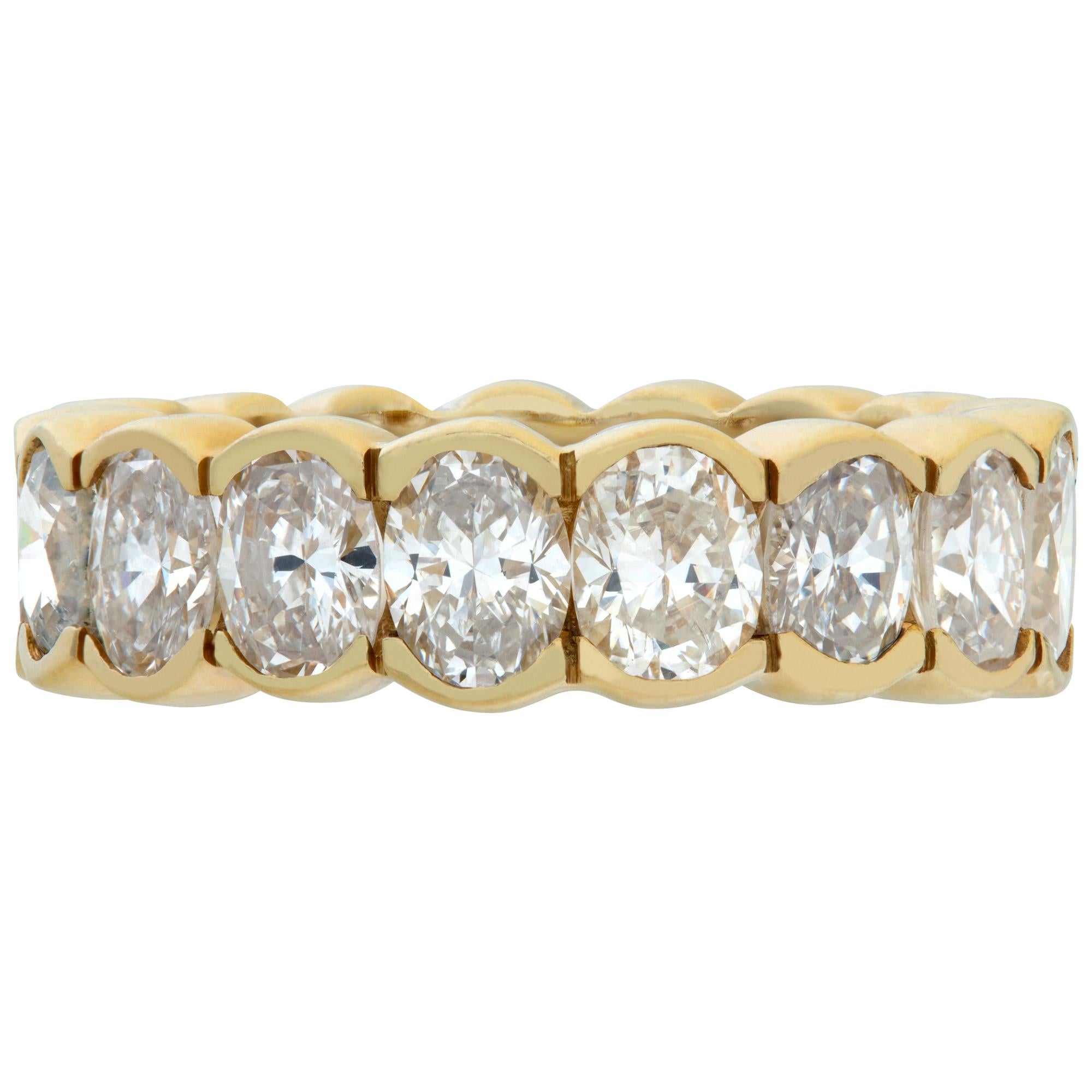 Oval diamonds cut eternity band set in 18K yellow gold, total oval brilliant cut diamonds approximately 4.00 carats, estimate G-H color, VS-SI clarity. Size 5, width 5.5mm.This Eternity Band ring is currently size 4.75 and some items can be sized up