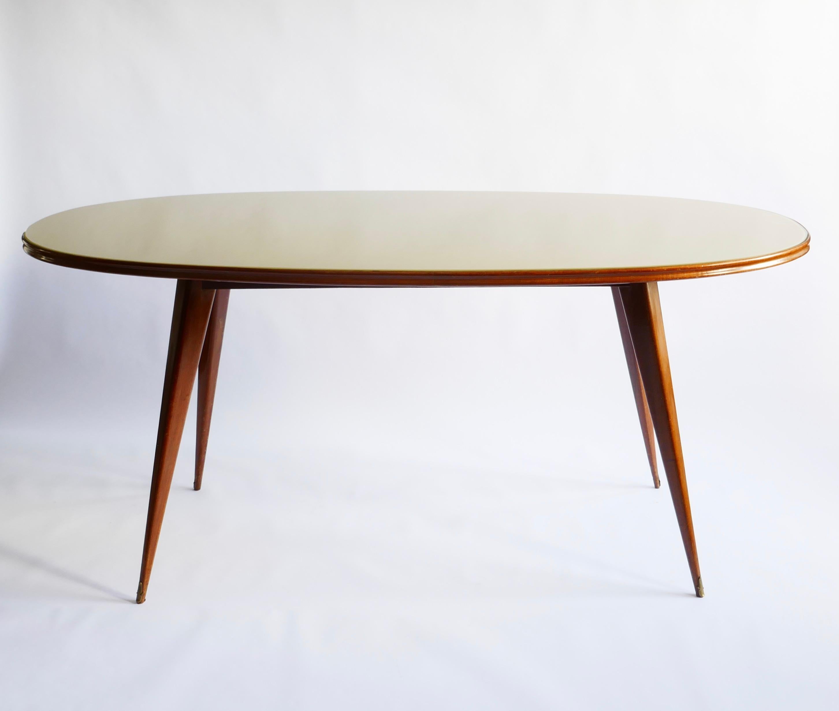 Minimalist beautiful Italian design for this oval shaped dining table with a mahogany structure and a pale green glass top.
Sits 6 comfortably. Its linear shape and size can see it transform into a console 
Measures: L189.5 x W 89.5 x H80cm.
 