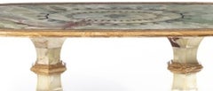 Oval dining room table in black marble, agate & fossilized wood, silver inlays