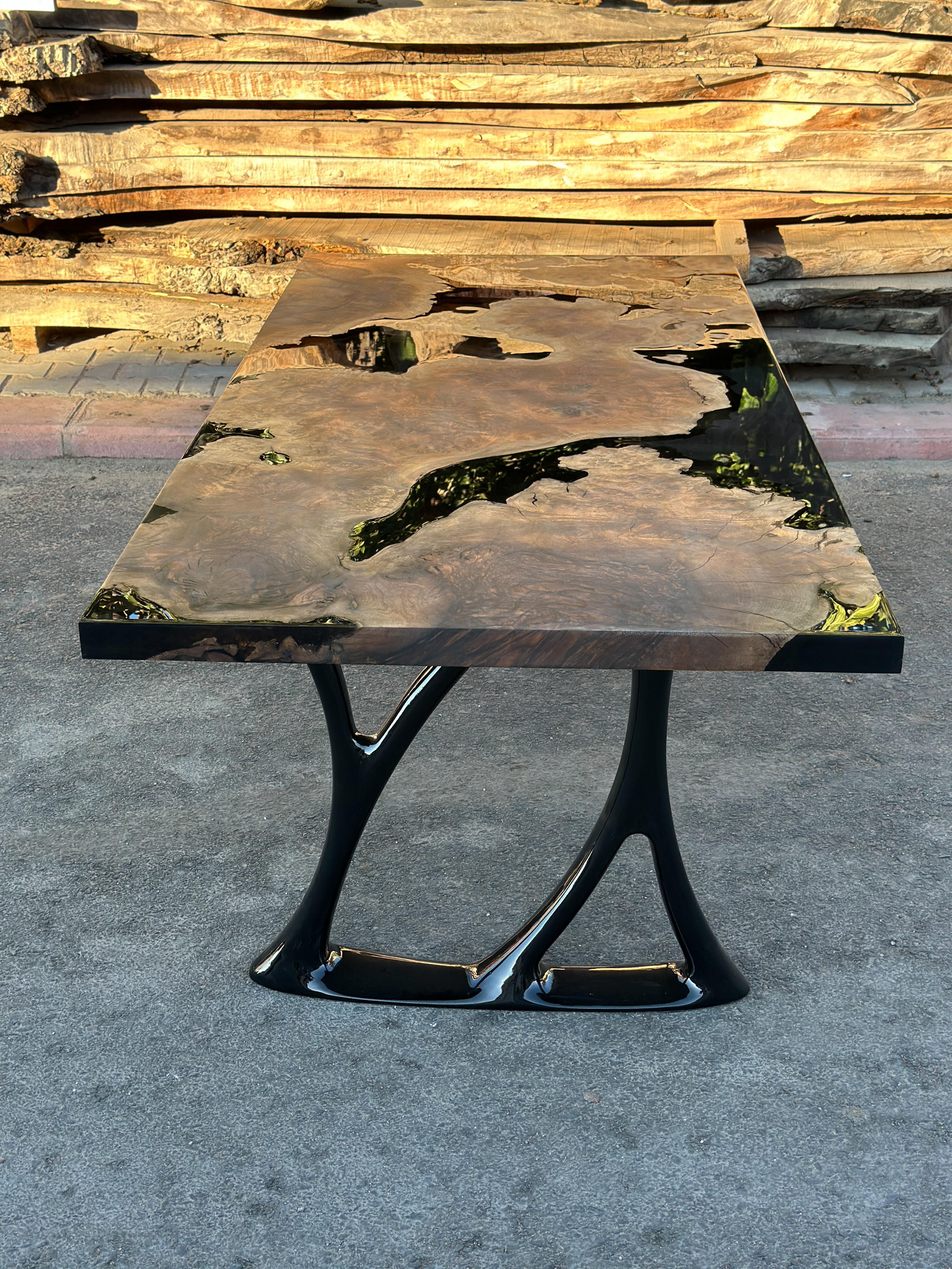 Black Walnut Epoxy Resin Dining Table / Kitchen Table

This table is made of 500 years old Walnut Wood. The grains and texture of the wood describe what a natural walnut woods looks like.
It can be used as a dining table or as a conference table.