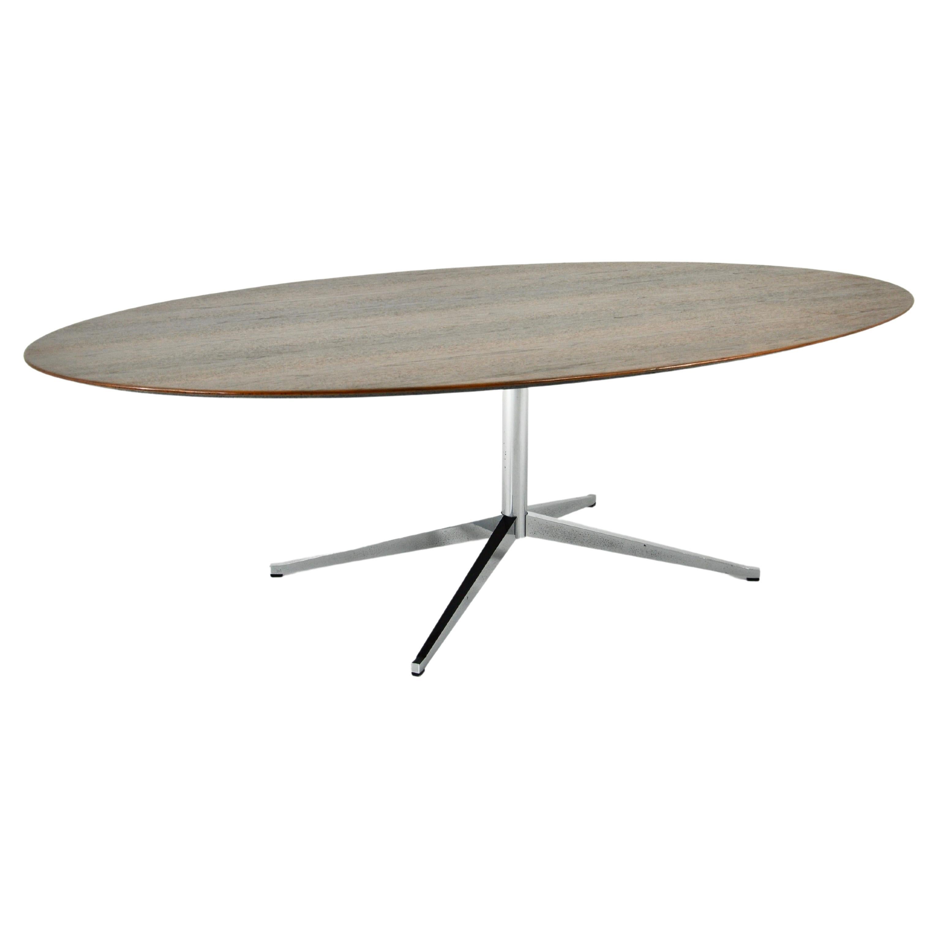 Table with wooden top and metal base by Florence Knoll. Large model. Wear due to time and age of the table.