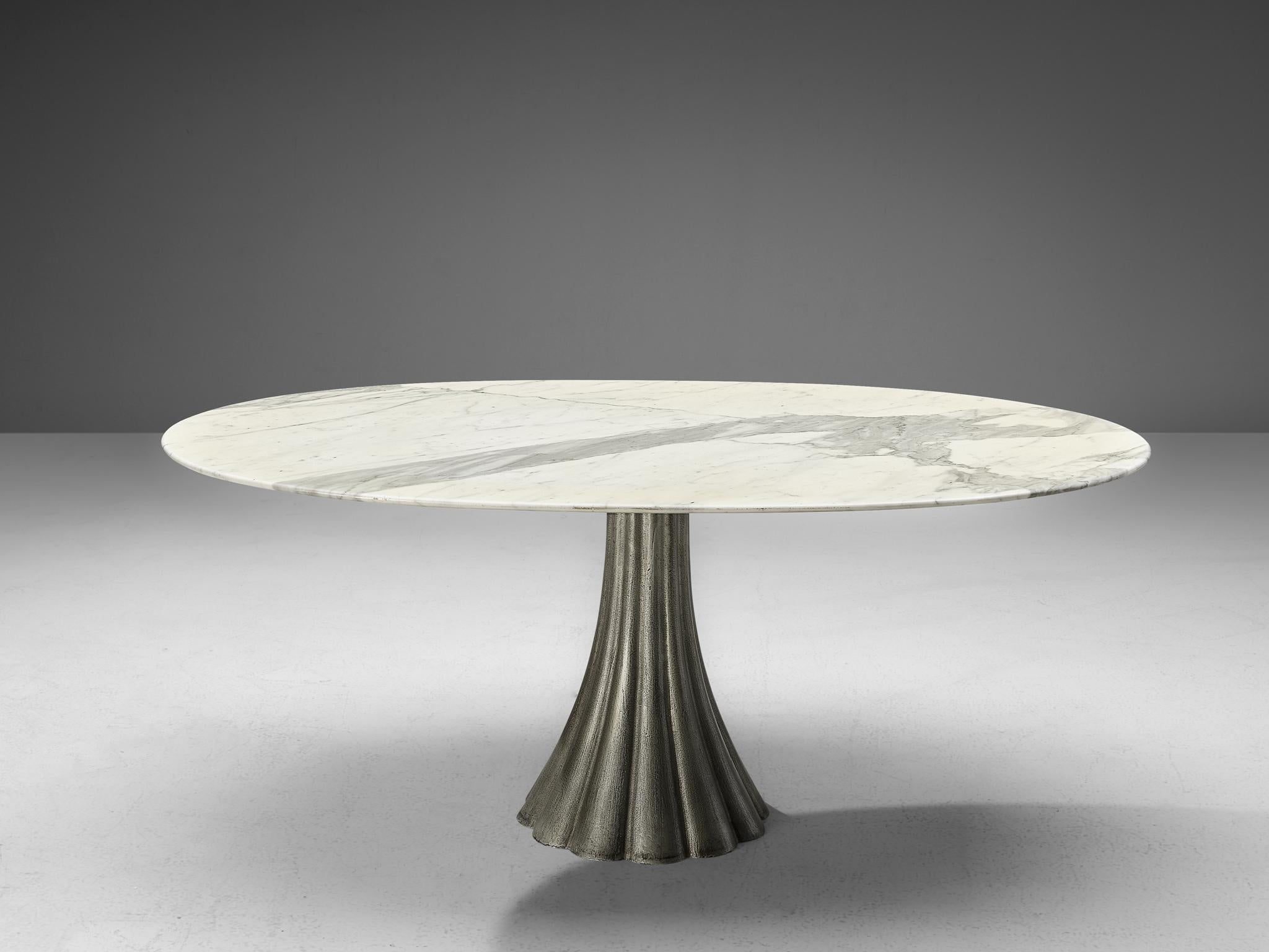 Oval dining table, attributed to Angelo Mangiarotti, marble, steel, Italy, 1960s

The oval shaped tabletop shows a beautiful play of natural the natural grey and white colors. The pedestal table is constructed with a scalloped shaped base, made out