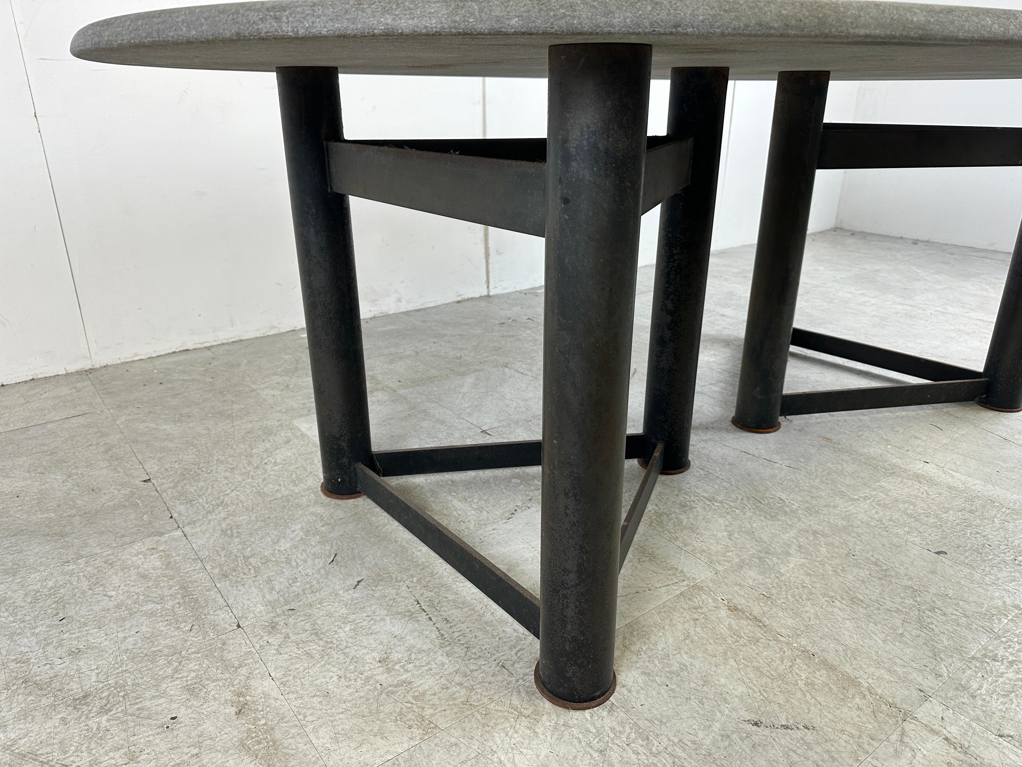 Vintage oval stone top dining table with a double tripod black metal base in the manner of Jan Vlug.

Beautiful timeless piece.

The stone top is nicely finished.

Good condition

1970s

Dimensions:
Height: 74cm/29.13