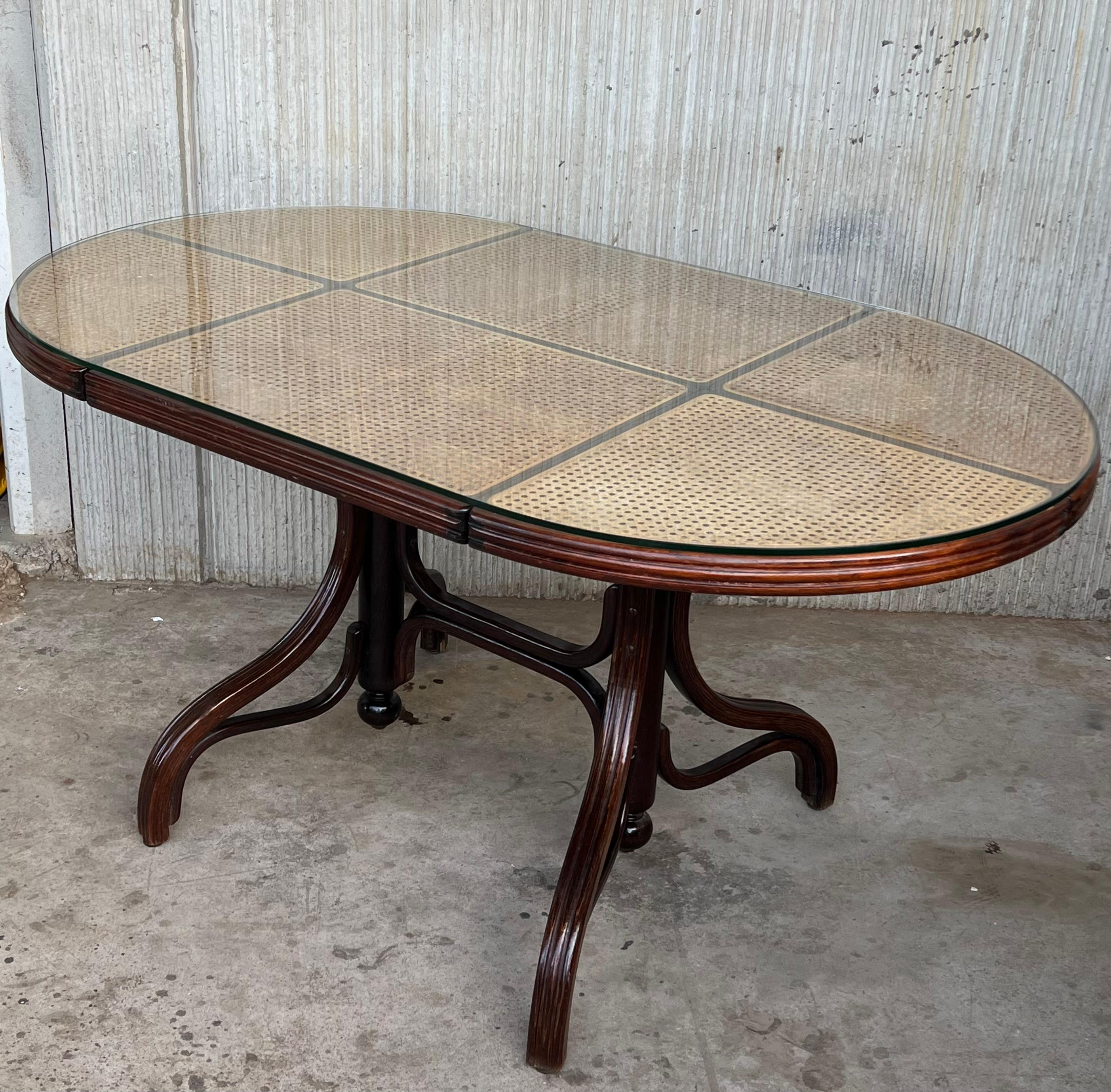 Oval dining table in wood, top cane and glass, Germany, 1970s.