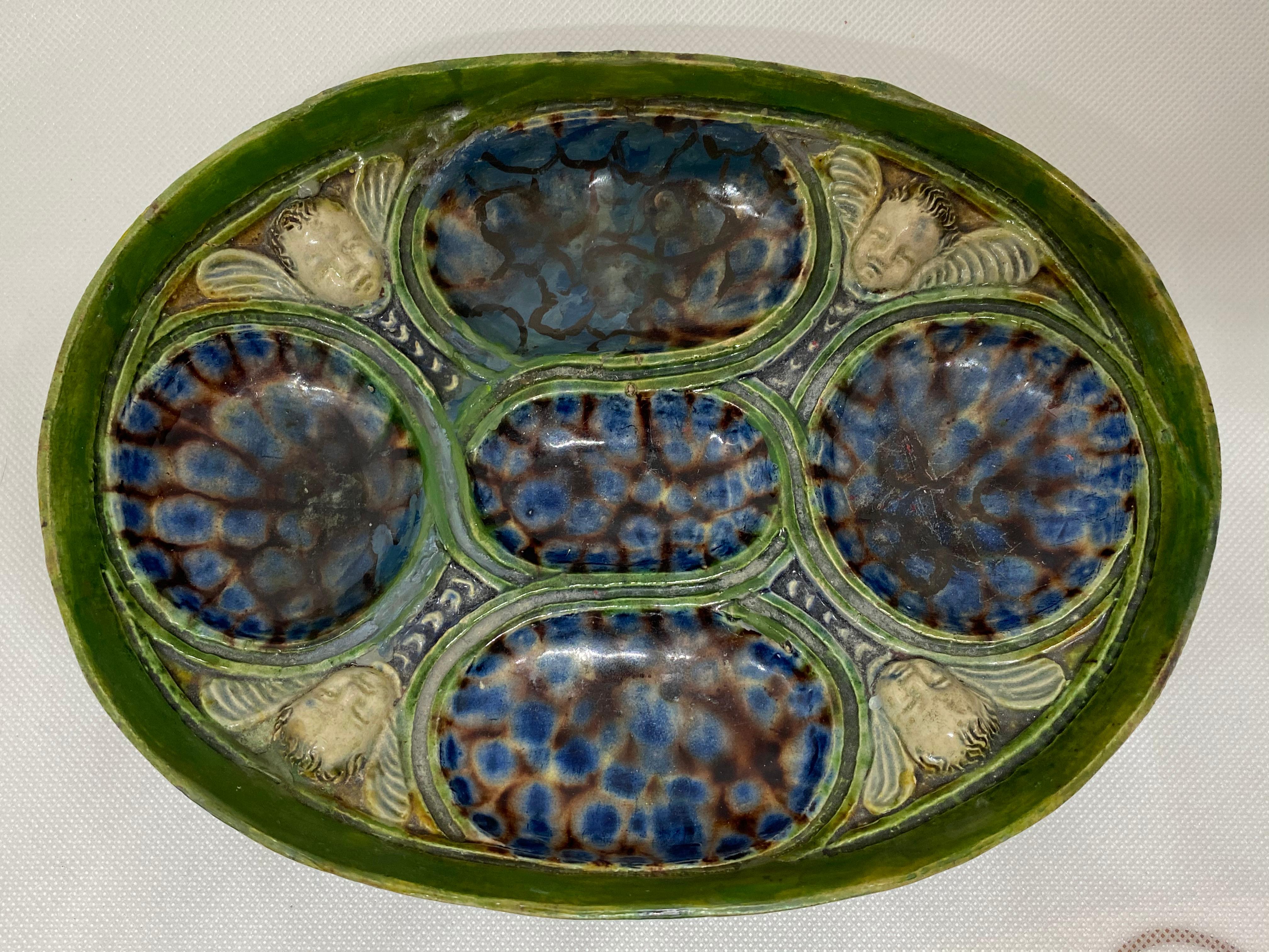 Glazed Oval Dish with Winged Putti, After Bernard Palissy, French, 17th Century For Sale
