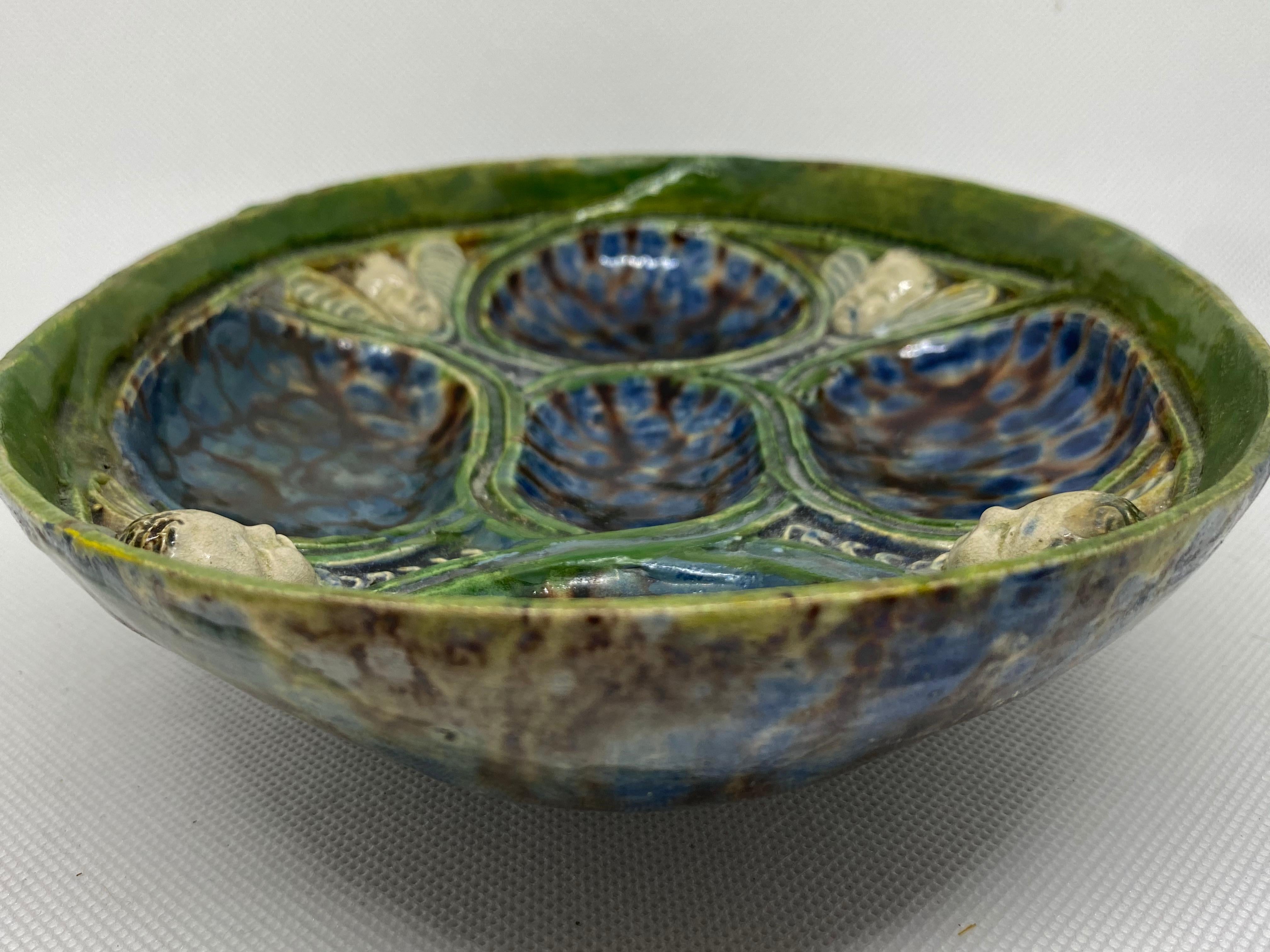 Earthenware Oval Dish with Winged Putti, After Bernard Palissy, French, 17th Century For Sale