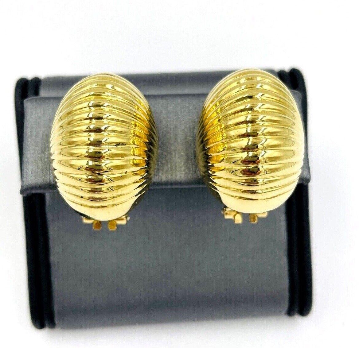 Domed yellow gold clip-on earrings by Garavelli circa 1970. *

ABOUT THIS ITEM:  #E-DJ51922C. Scroll down for specifications.  Elegant gold domed earrings with a subtle, fluted, horizontal motif that causes light to reflect in a rippling motion up