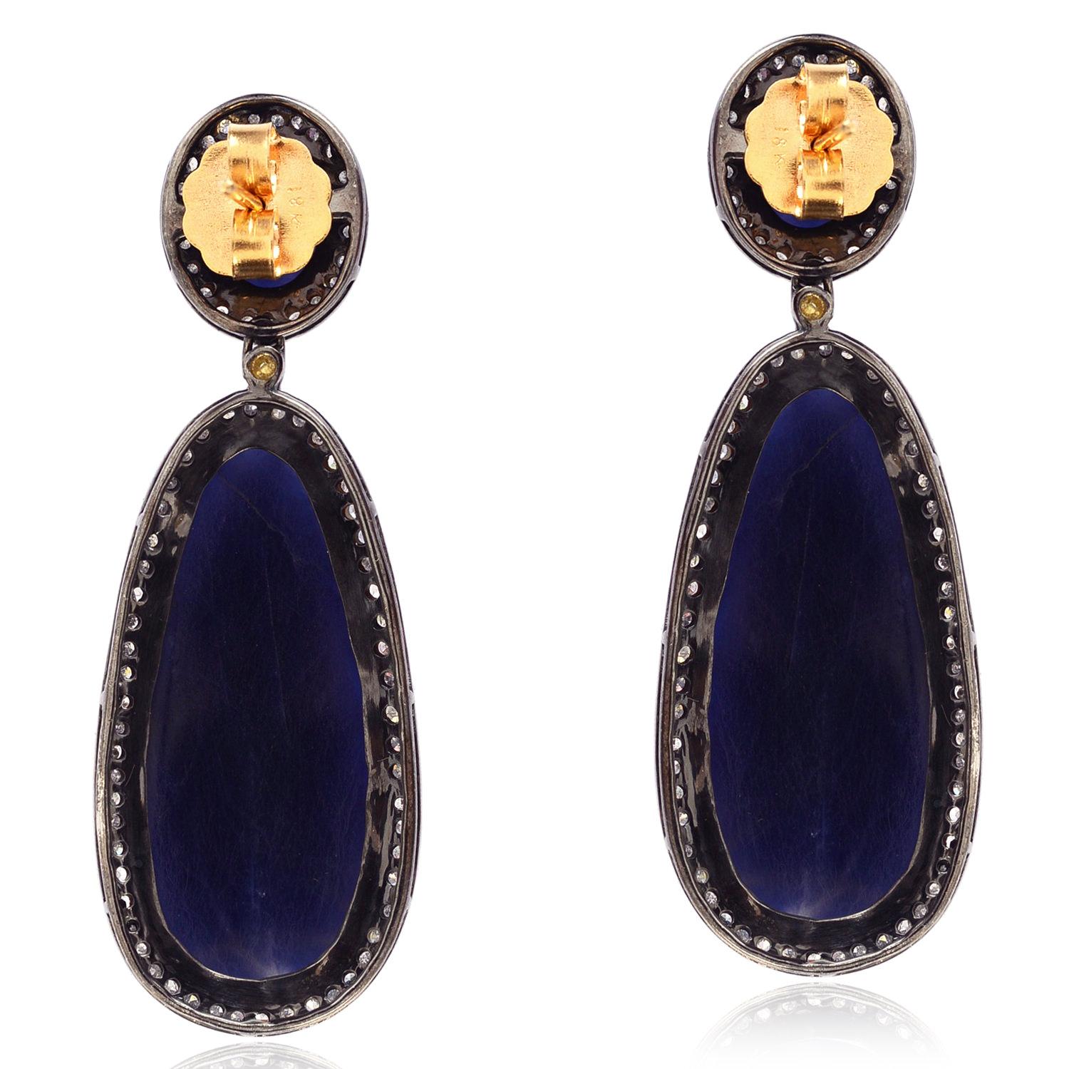 Make a statement with these stunning Oval & Drop Shaped Sapphire Earrings featuring Pave Diamond accents in 18k Gold & Silver. Perfect for adding a touch of elegance to any outfit, these earrings are sure to become a cherished addition to your