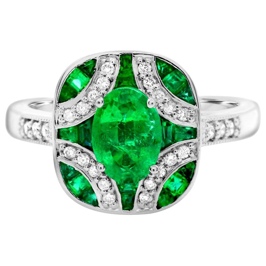 Oval Emerald 0.80 Carat with Baguettes and Diamonds 14 Karat Gold Cocktail Ring For Sale