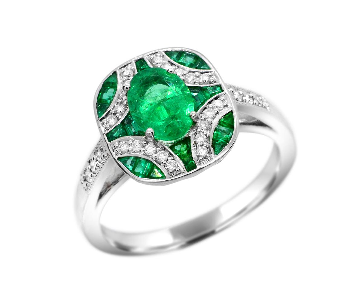 Oval 0.80 Carat Emerald with baguettes and diamonds in 14Karat White Gold Cocktail Ring 

This ring is for the true emerald lover! Every nook-and-cranny is full of special-cut emeralds that are patiently set by hand by our master setters.

The