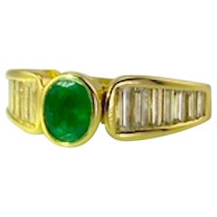 Oval Emerald .73 Carat and .95 TW Diamond Ladies Ring 18 Karat Yellow Gold