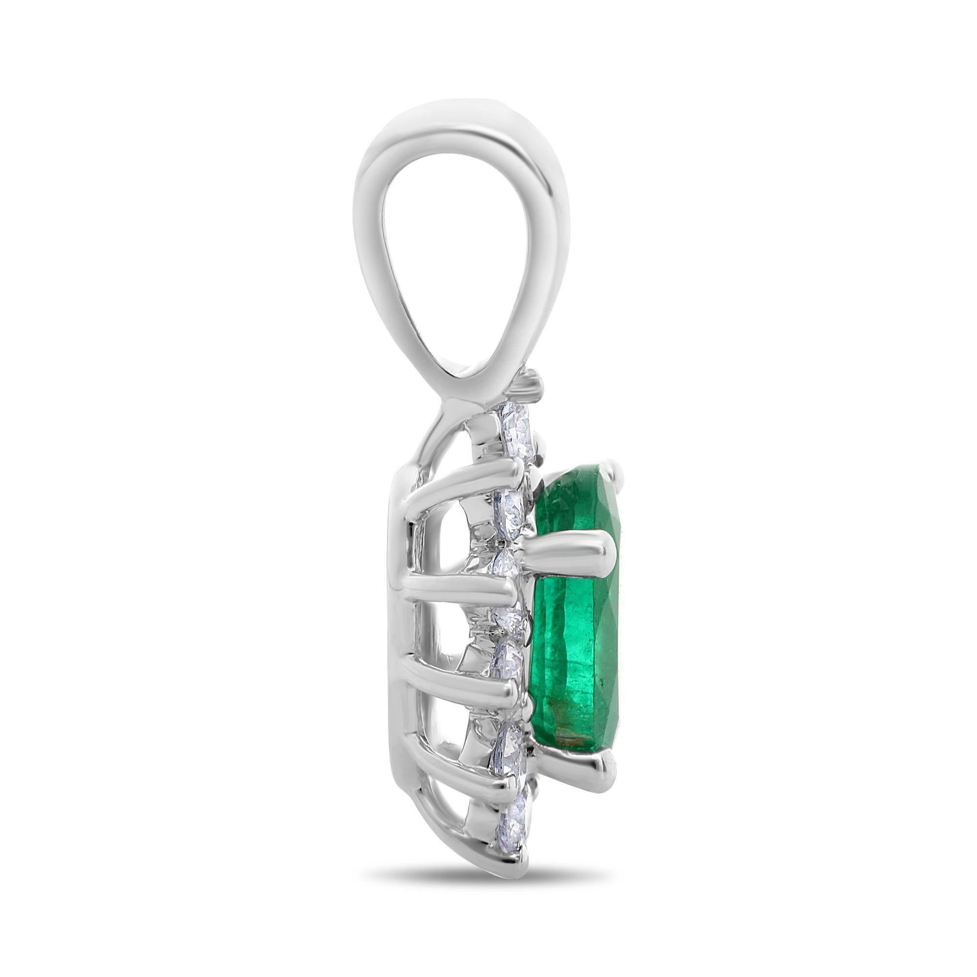 Made of 18K white gold, this pendant showcases a 0.46 carat, oval cut green emerald at the center. The colorful center stone is brought to life by 0.20 carats of round cut white diamonds in a sparkling single halo.

The center stone is of SI clarity