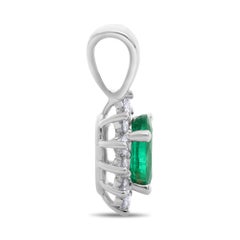 Oval Emerald, White Diamond, and 18 Karat White Gold Halo Pendant