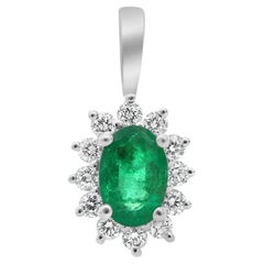 Oval Emerald, White Diamond, and 18 Karat White Gold Halo Pendant