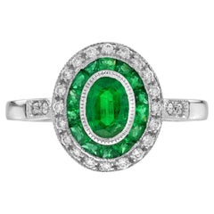 Anello di fidanzamento target con smeraldo ovale e diamante in stile Art Déco in oro bianco 18 carati