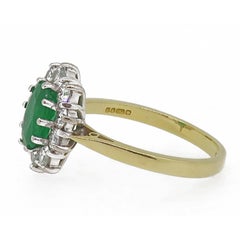 Oval Emerald and Diamond Claw Set Cluster Ring 18 Karat Yellow and White Gold