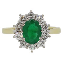 Oval Emerald and Diamond Claw Set Cluster Ring 18 Karat Yellow and White Gold