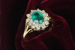 Oval Emerald and Diamond Cluster Cocktail Ring in Yellow Gold
