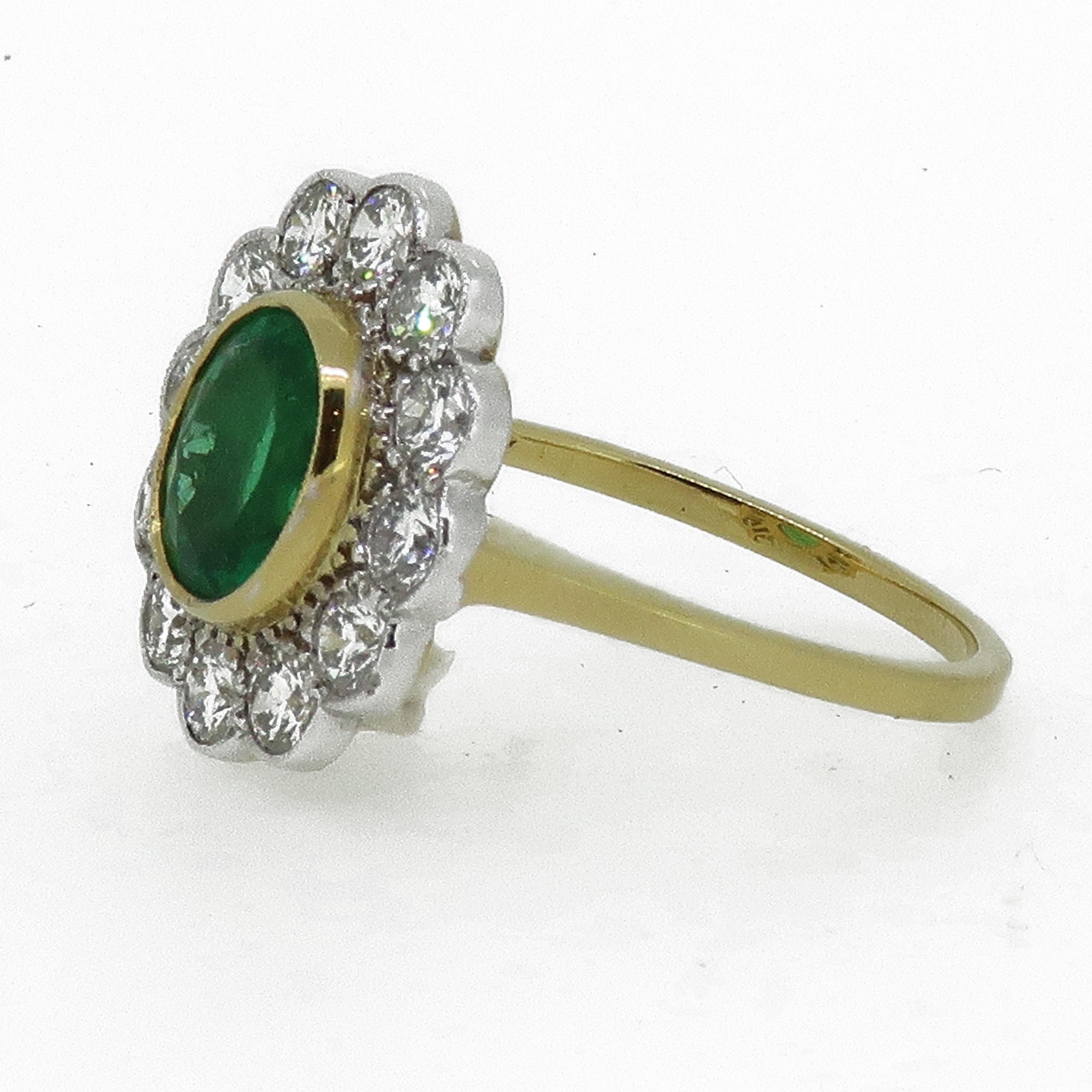 Oval Emerald and Diamond Cluster Ring 18 Karat Yellow And White Gold

Large classic handmade oval emerald and diamond cluster ring. The stunning vibrant green Columbian emerald is encased in an 18ct yellow gold bezel, surrounded by twelve white