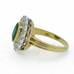 Oval Emerald and Diamond Cluster Ring 18 Karat Yellow and White Gold