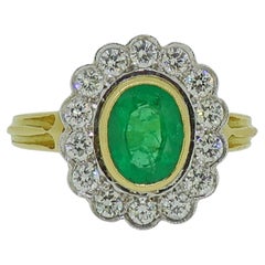 Oval Emerald and Diamond Cluster Ring 18 Karat Yellow and White Gold