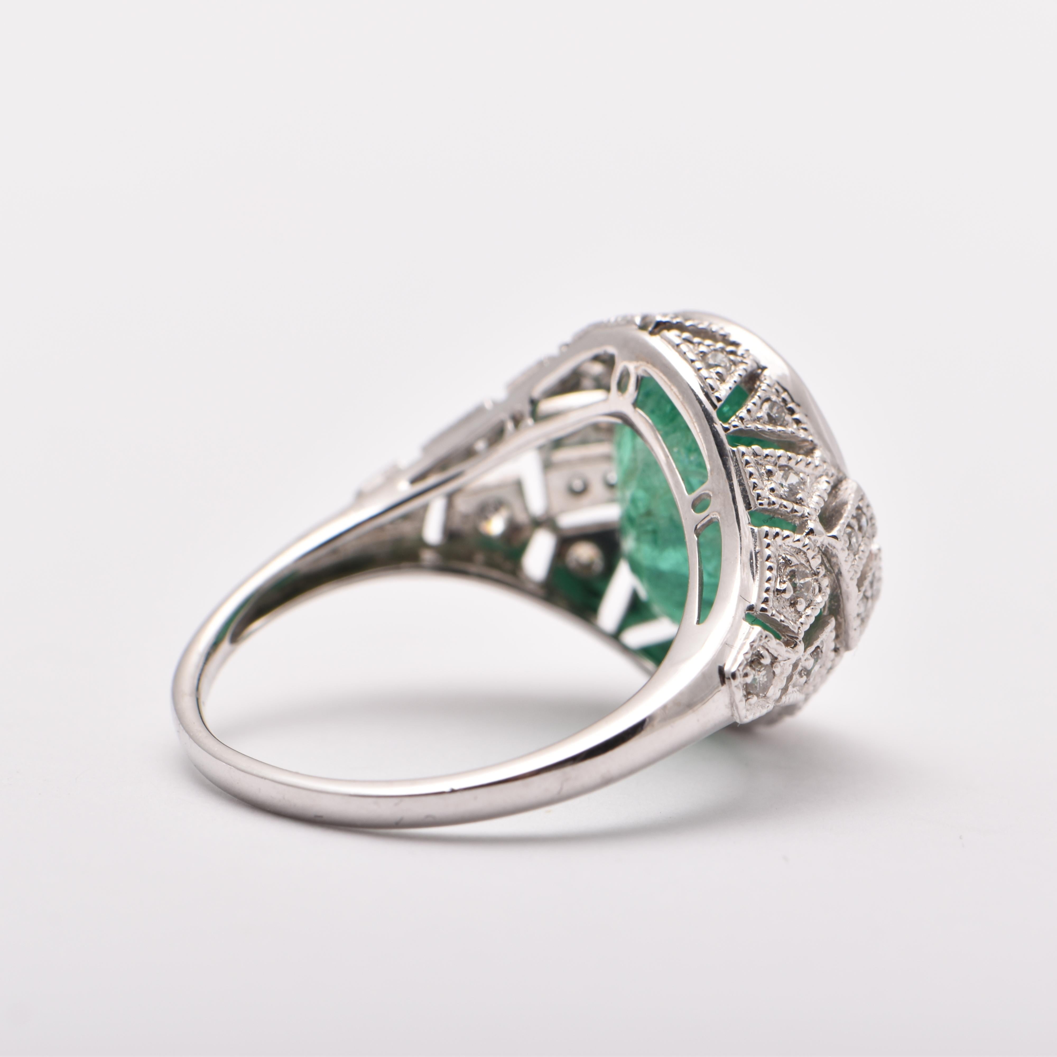 Oval Cut Oval Emerald and Diamond Cocktail Ring in Platinum For Sale